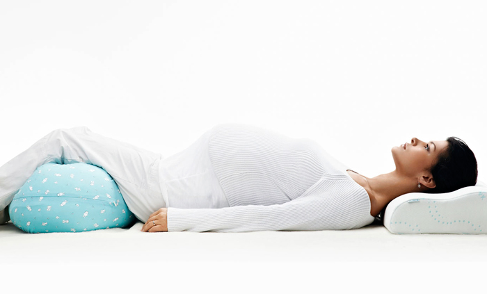 Как выбрать подушку для беременных: использование постельного атрибута
